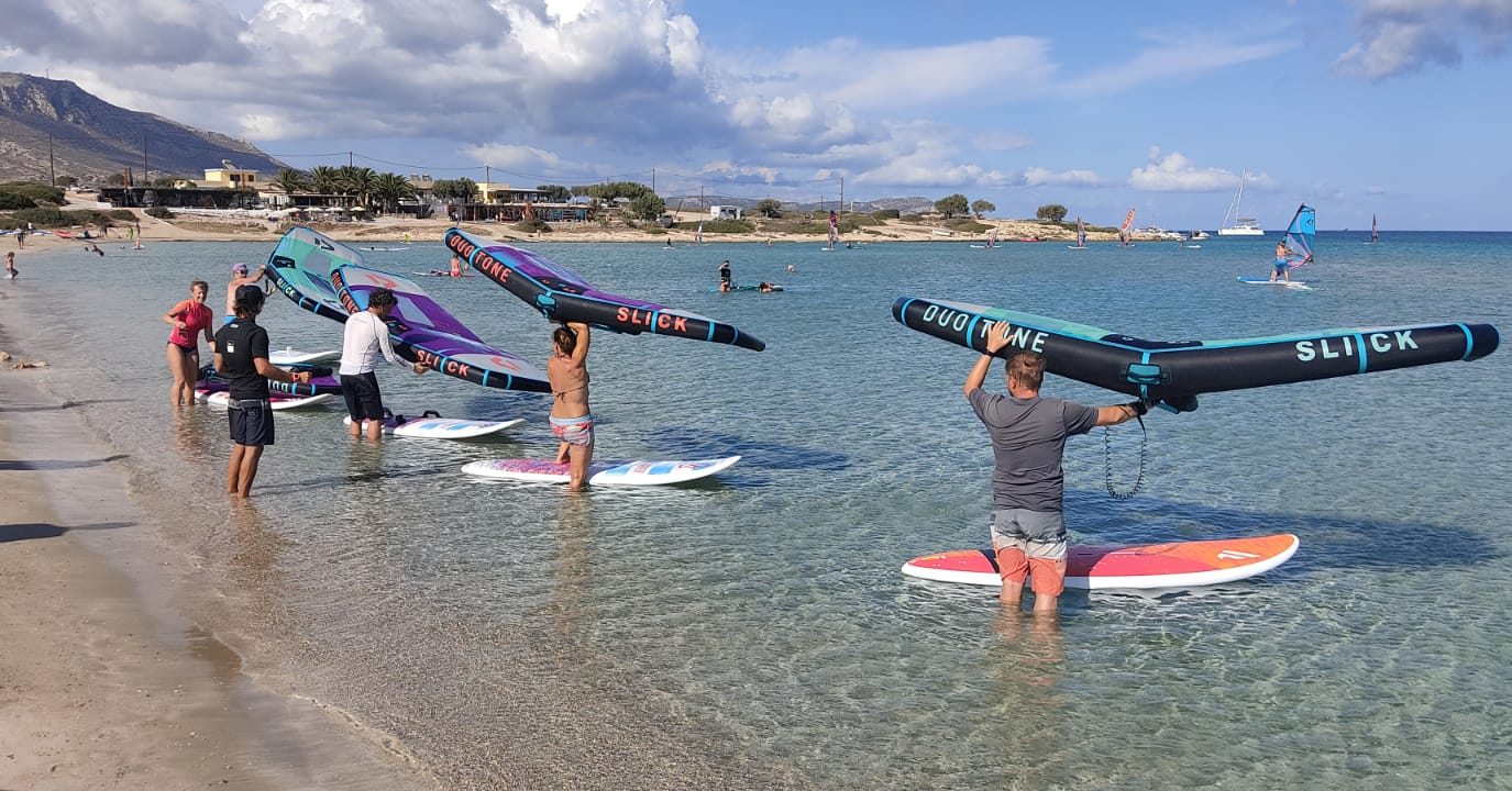 Wing learners knee-deep in the Chicken Bay lagoon, ION Karpathos